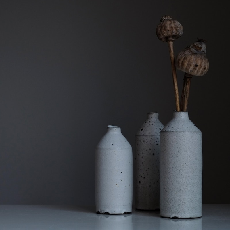 Potter shaping the mug on wheel